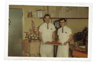 Bill Koch learning the meat department at a young age.